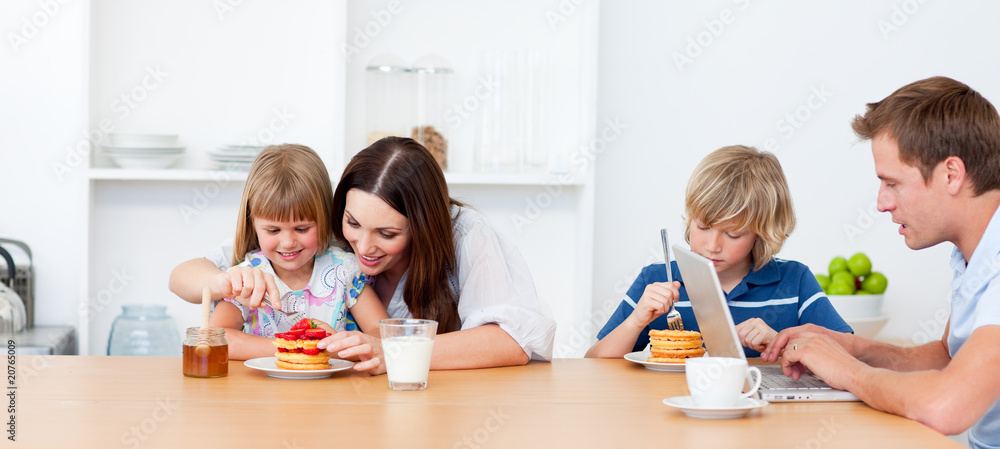 Merry family eating breakfast in the kitchen Merry family eating breakfast in the kitchen