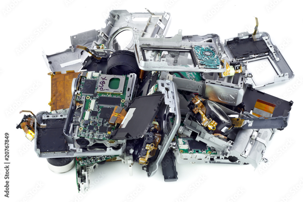 Broken mass digital cameras on a garbage dump Broken mass digital cameras on a garbage dump