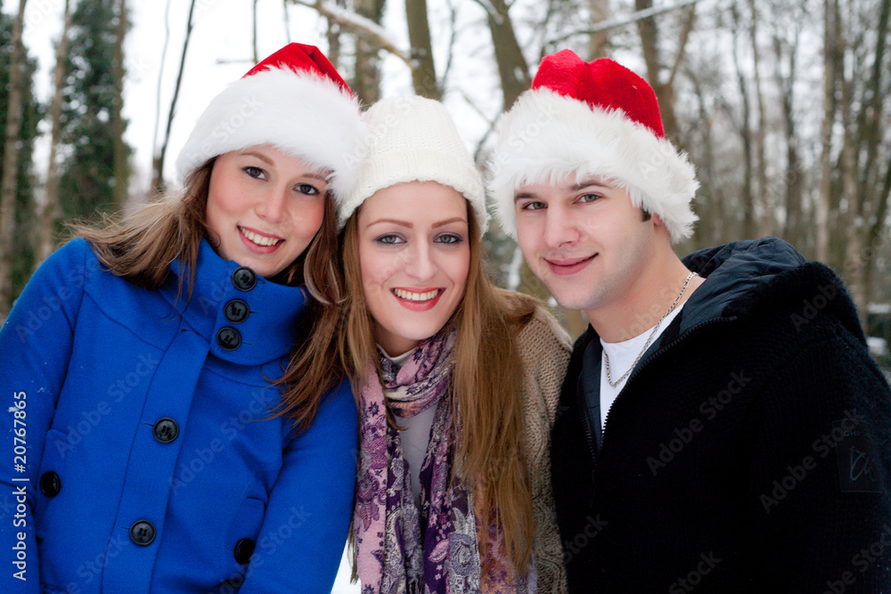 trio enjoying a christmas day outside trio enjoying a christmas day outside