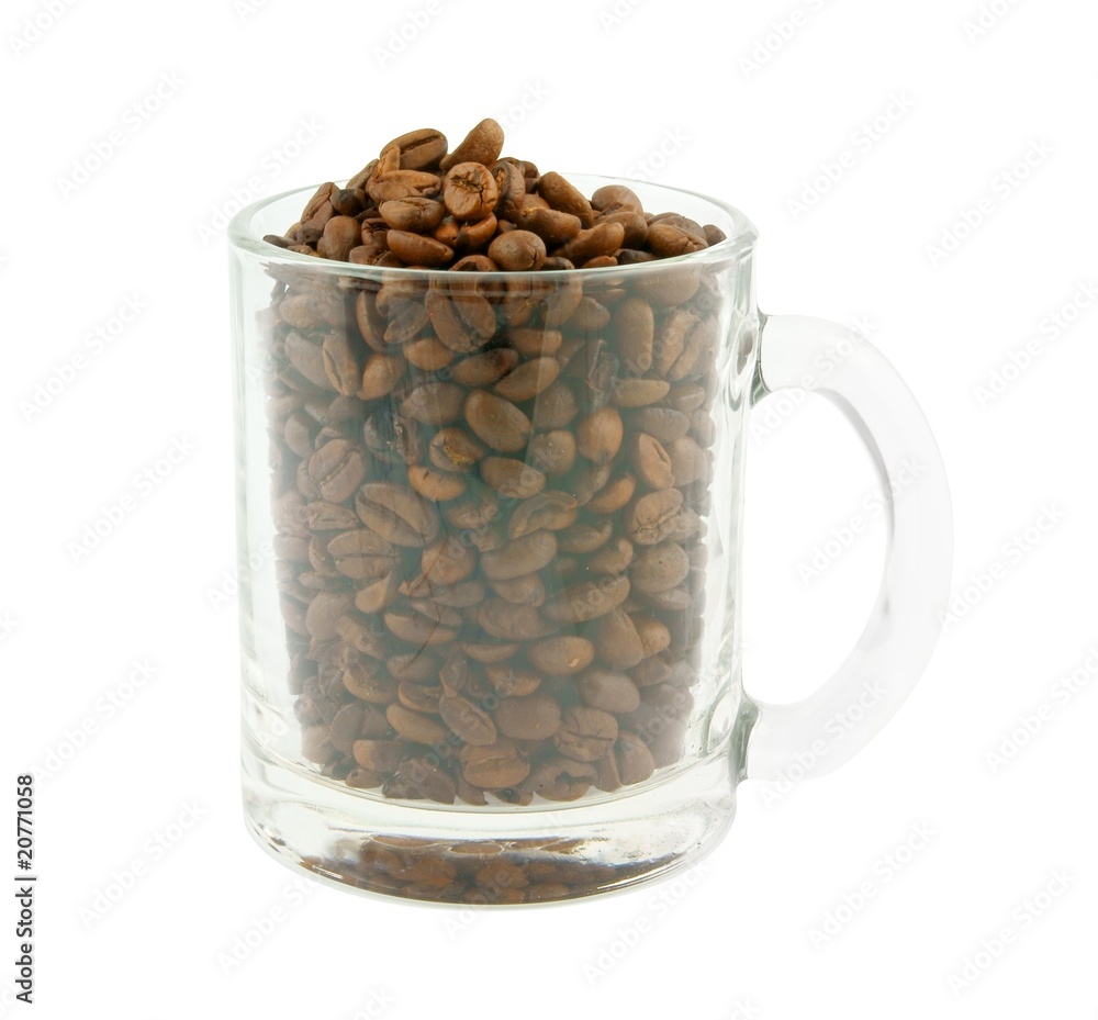 Glass cup with coffee grains isolated on white Glass cup with coffee grains isolated on white