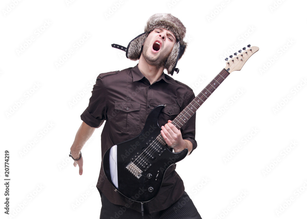 Guitar player jumping in midair isolated against white Guitar player jumping in midair isolated against white