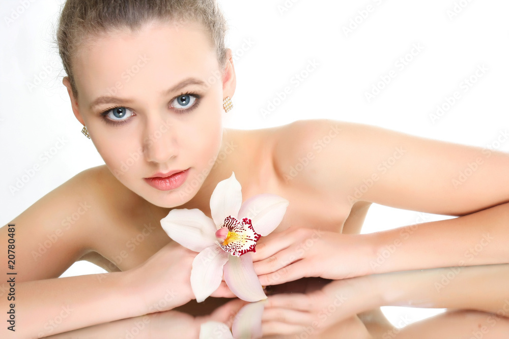 studio shot of beautiful young woman reflected in mirror studio shot of beautiful young woman reflected in mirror