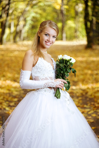 Beautiful young bride in a park