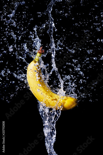 fresh banana gets hit by a water stream