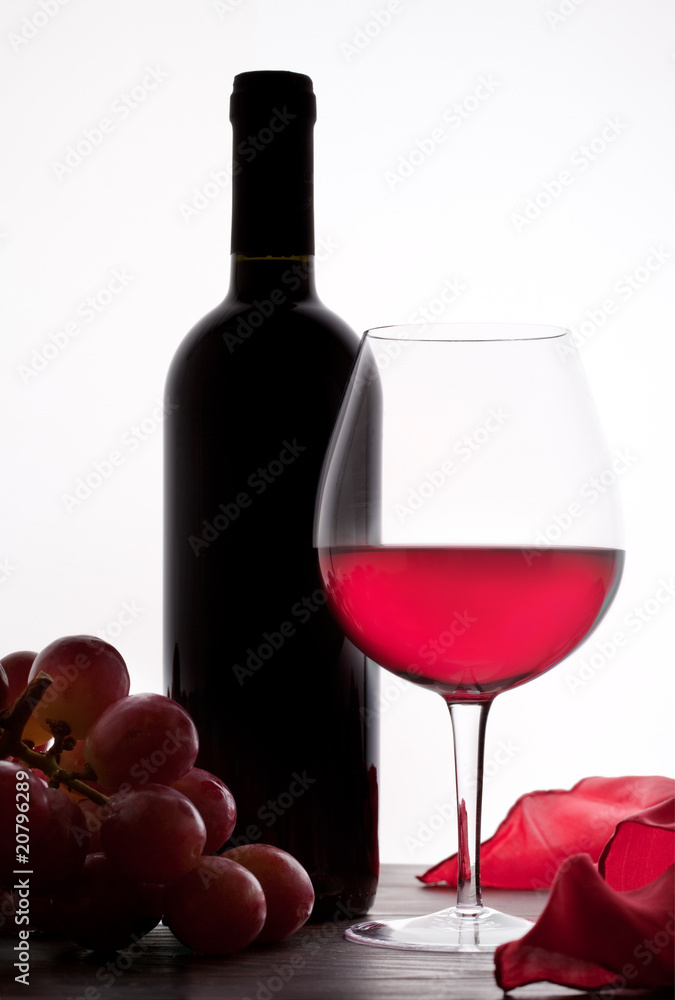 Red Wine and grapes, white background.