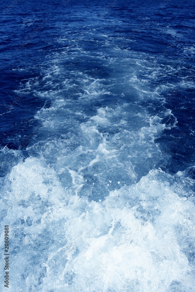 Fototapeta premium Boat wake foam water propeller blue wash