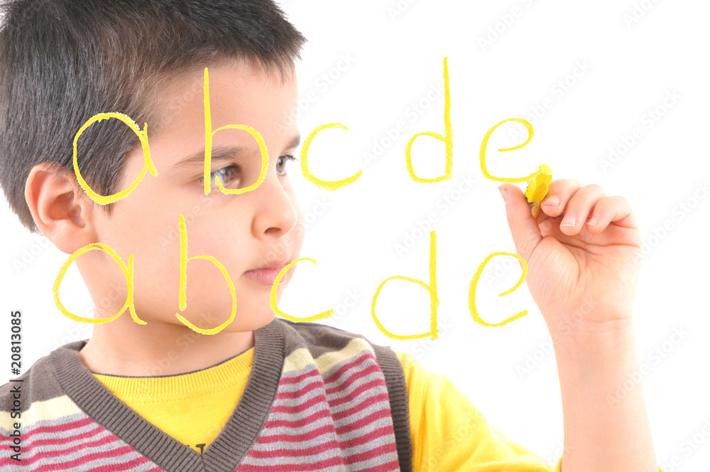 little boy writing letters on glass little boy writing letters on glass