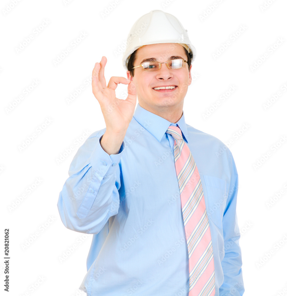 An engineer with white hard hat showing okay symbol An engineer with white hard hat showing okay symbol