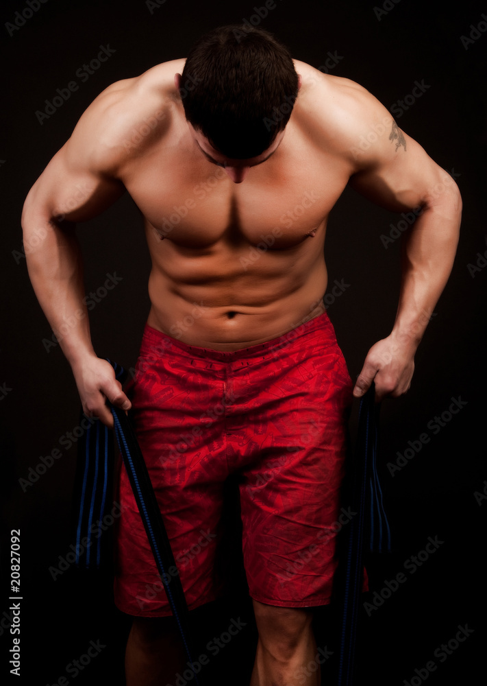 Athlete exercising with rope Athlete exercising with rope