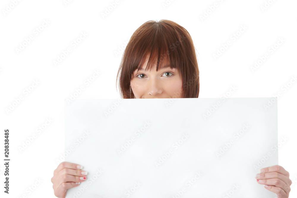 A pretty young woman holding a blank sign A pretty young woman holding a blank sign