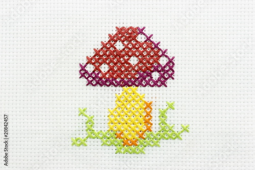 Embroidery of the image of a mushroom