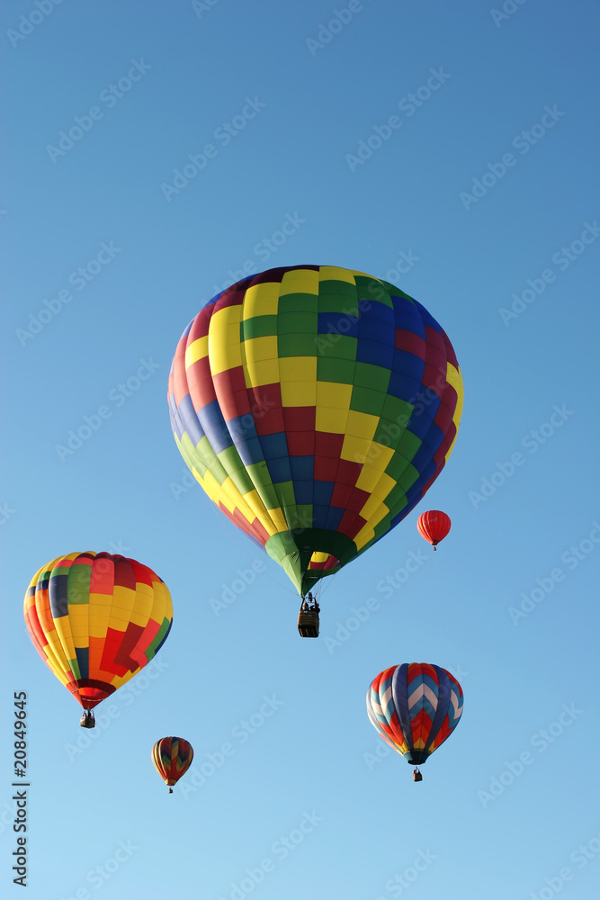 Hot air balloons are flying during a festival Hot air balloons are flying during a festival