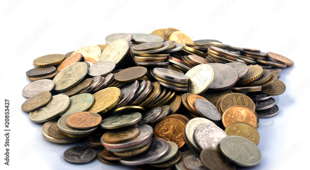 A handful of coins on a white background, isolated A handful of coins on a white background, isolated