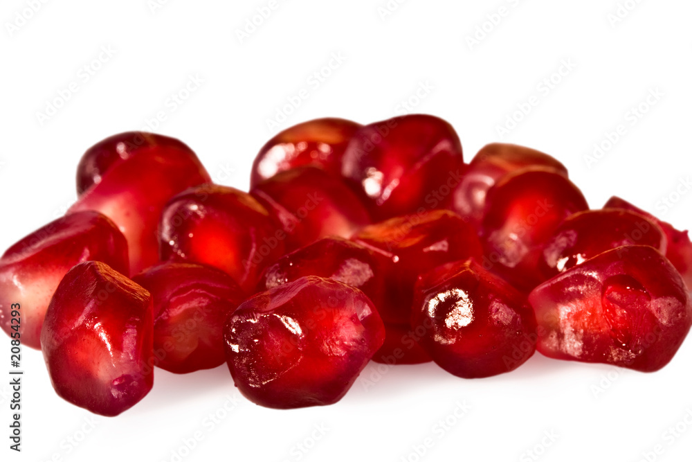 Juicy red pomegranate of grain close up isolated Juicy red pomegranate of grain close up isolated