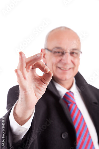 Mature Businessman signaling ok