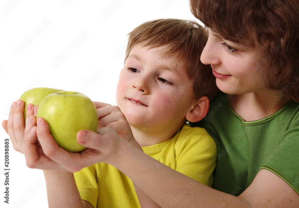 Mother gives son an apple