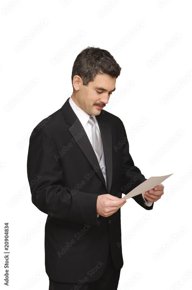 groom looking at marraige license groom looking at marraige license