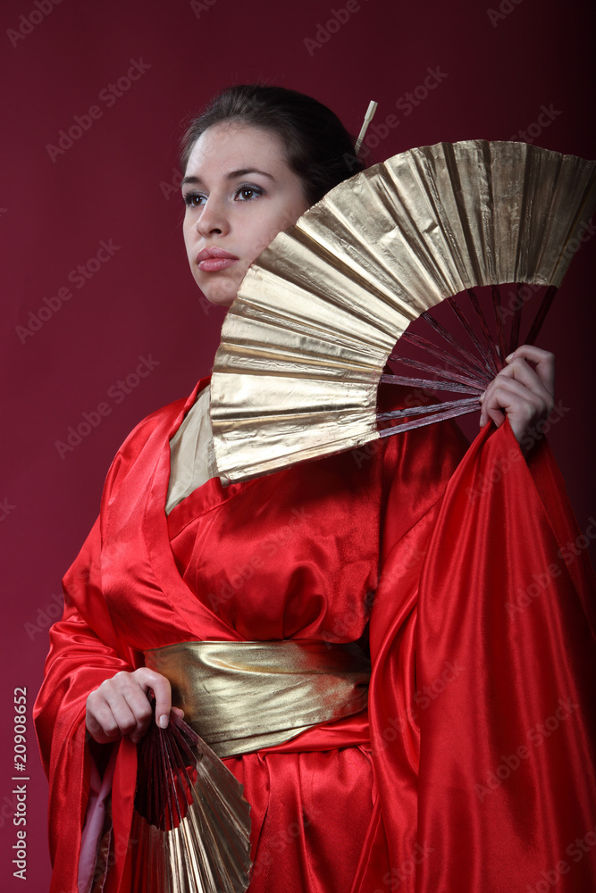 Girl in a kimono with two funs Girl in a kimono with two funs