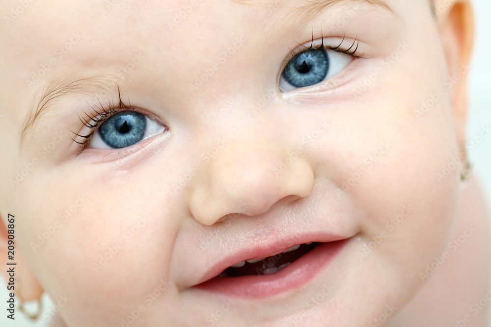 Detailed face of beautiful blue-eyed baby girl taking bath Detailed face of beautiful blue-eyed baby girl taking bath