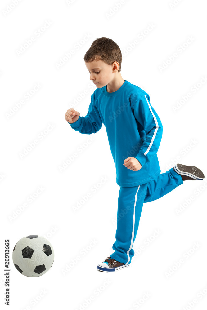 Boy executing a football kick Boy executing a football kick
