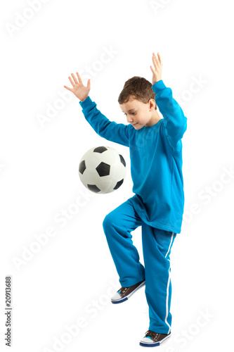 Fototapeta Naklejka Na Ścianę i Meble -  Boy executing a football kick