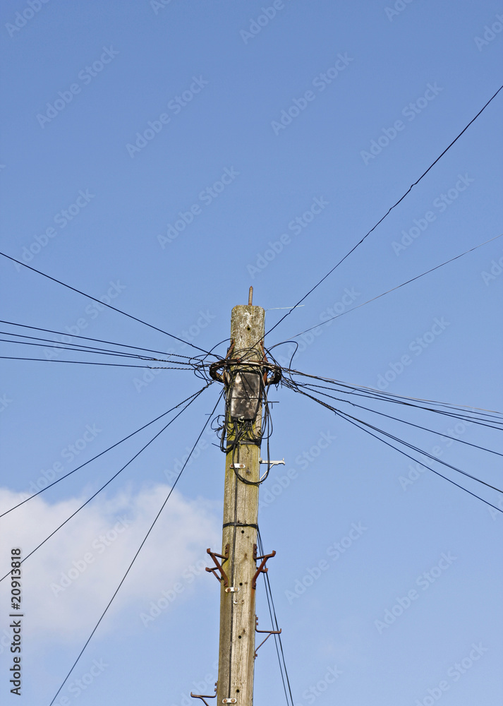 Telegraph pole against blue sky Telegraph pole against blue sky