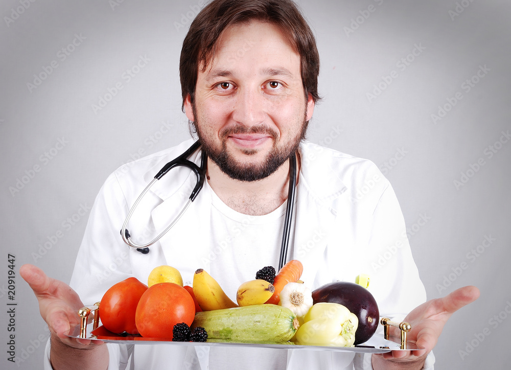 Young male doctor advising healthy natural food Young male doctor advising healthy natural food