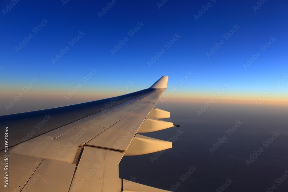 aero plane wing and beautiful evening sky
