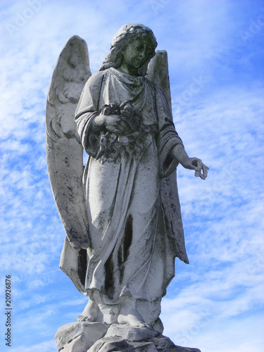 Angel guardian under blue sky photo