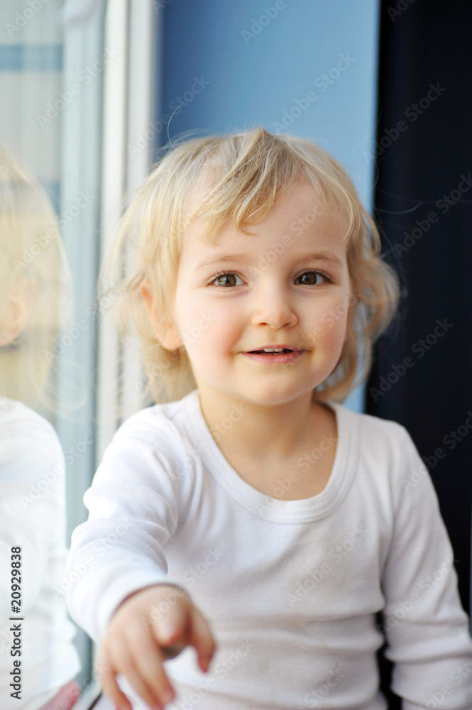 girl sits at window girl sits at window