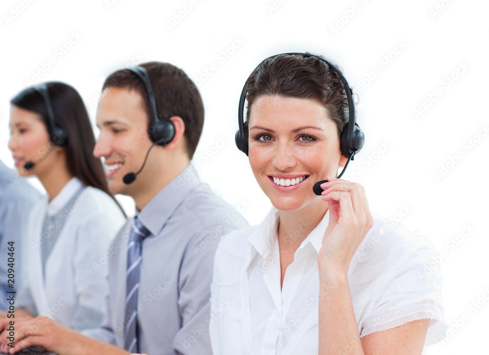 Enthusiastic customer service agents working in a call center Enthusiastic customer service agents working in a call center