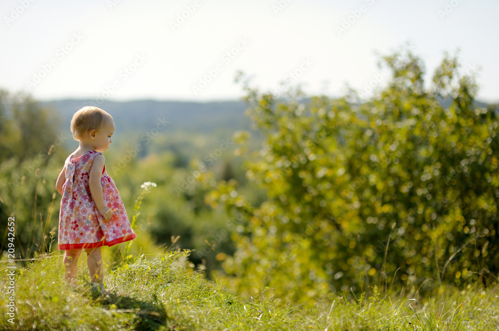 Little baby girl on the edge of a cliff Little baby girl on the edge of a cliff
