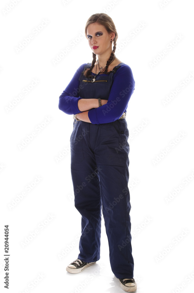 Mädchen im Blaumann ist genervt, stehend Mädchen im Blaumann ist genervt, stehend