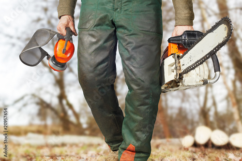 logger comming with his gear