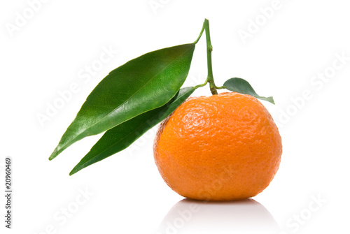 Tangerine with green leaves isolated on white