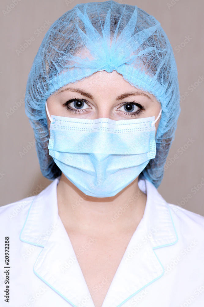 Closeup portrait of a young doctor wearing a mask Closeup portrait of a young doctor wearing a mask