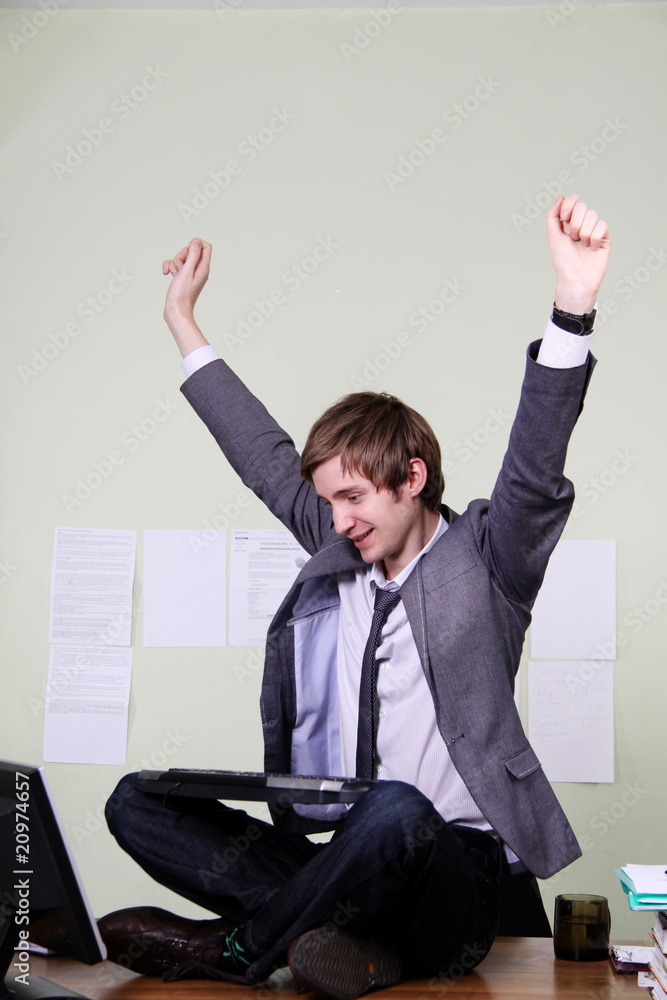 Young successful man in his office Young successful man in his office