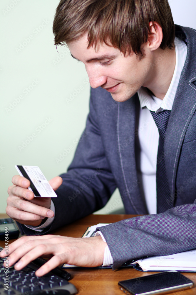 Image of hands holding credit card