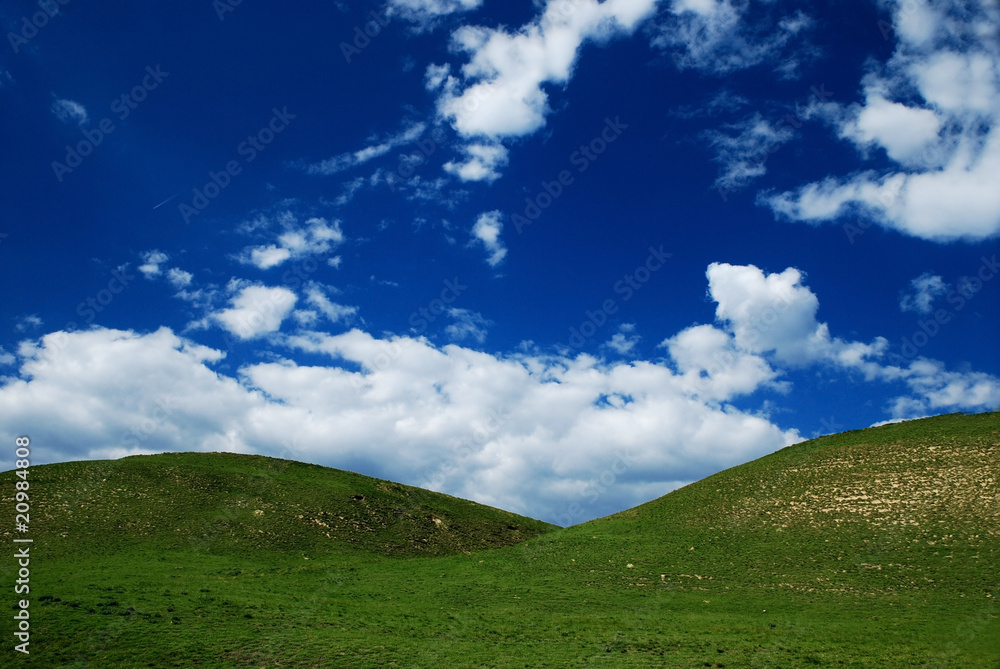 Nature background with clouds and hills