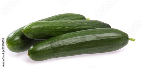 Fresh cucumbers on white