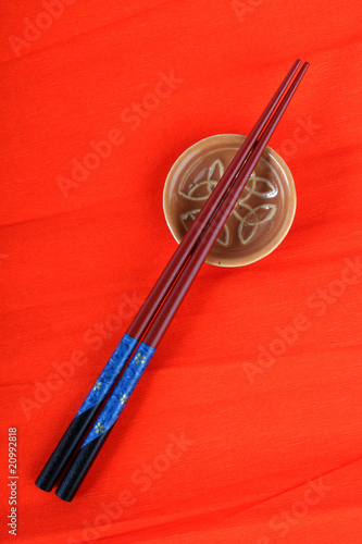 Chopsticks on a red background
