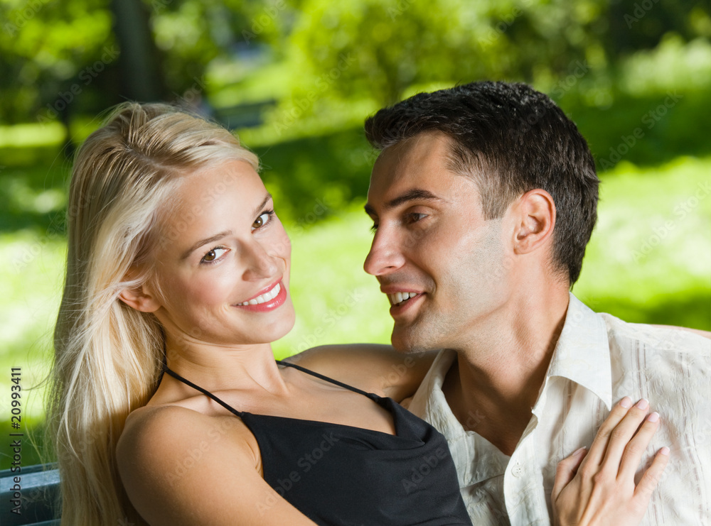 Young happy amorous couple together, outdoors Young happy amorous couple together, outdoors