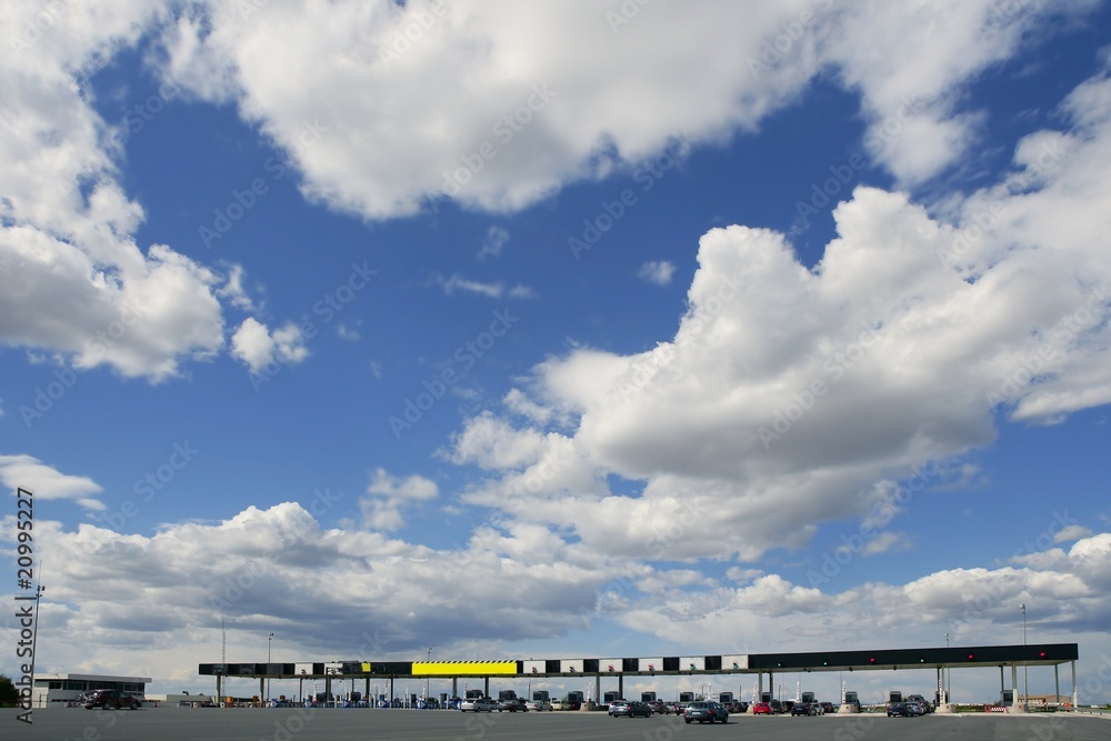 Toll motorway road in Europe in a sunny blue day with clouds Toll motorway road in Europe in a sunny blue day with clouds