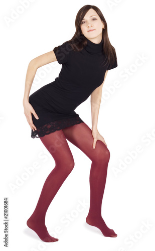 Lovely woman in red stockings posing over white background
