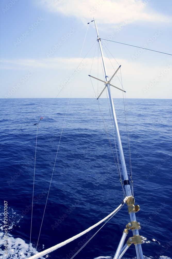 Blue sea with outrigger fishing boat equipment Blue sea with outrigger fishing boat equipment