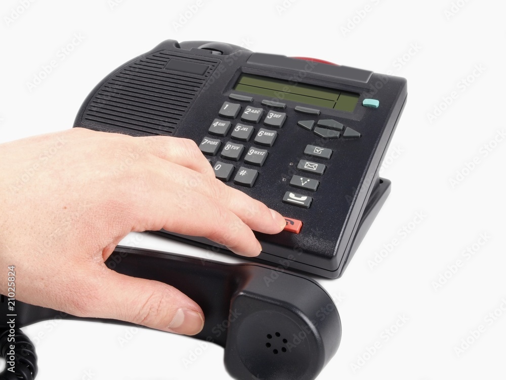Someone pressing the red hang-up dial on a telephone Someone pressing the red hang-up dial on a telephone