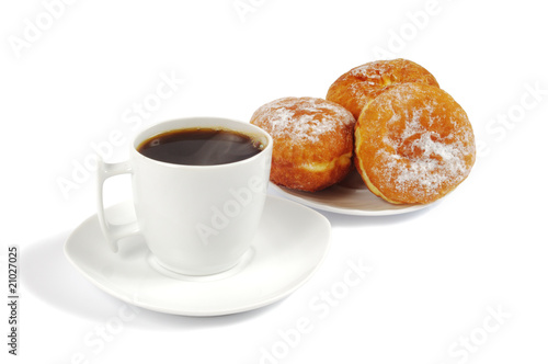 A cup of coffee and saucer with donuts