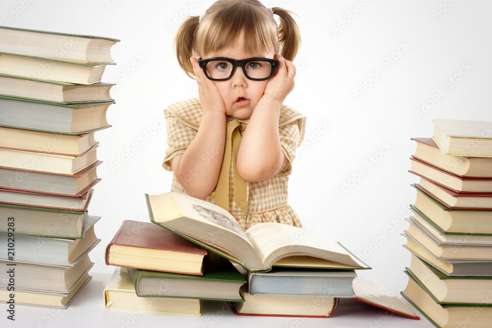 Little girl with books wearing black glasses Little girl with books wearing black glasses
