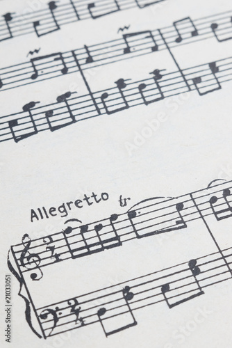 music notes sheet with selective focus on allegretto text
