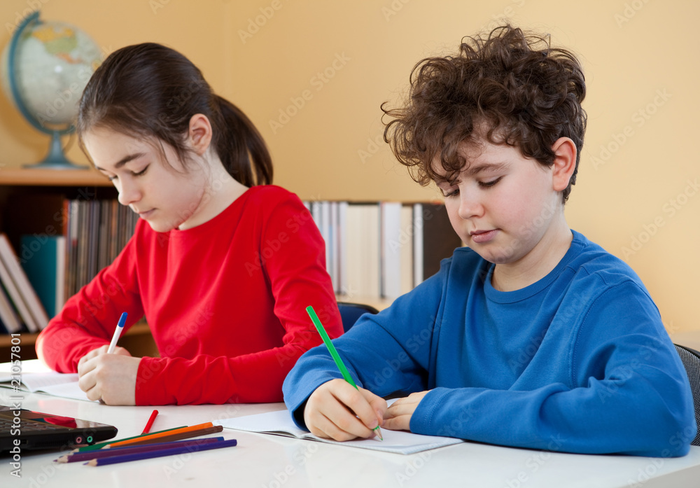 Young girl and boy learning at home Young girl and boy learning at home